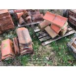QUANTITY OF ASSORTED TERRACOTTA RIDGE ROOF TILES, MOSTLY 18", BETWEEN 110-115 ANGLE