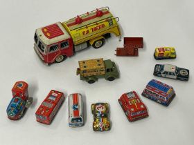 Vintage tinplate friction oil tanker and nine small vintage tinplate vehicles including fire