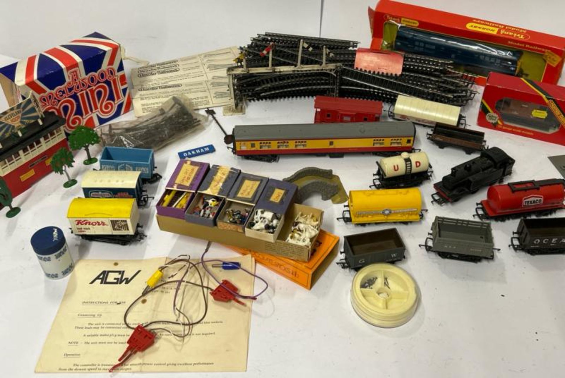 Collection of model trains, track and accessories including Hornby diesel engine D5572, figures,