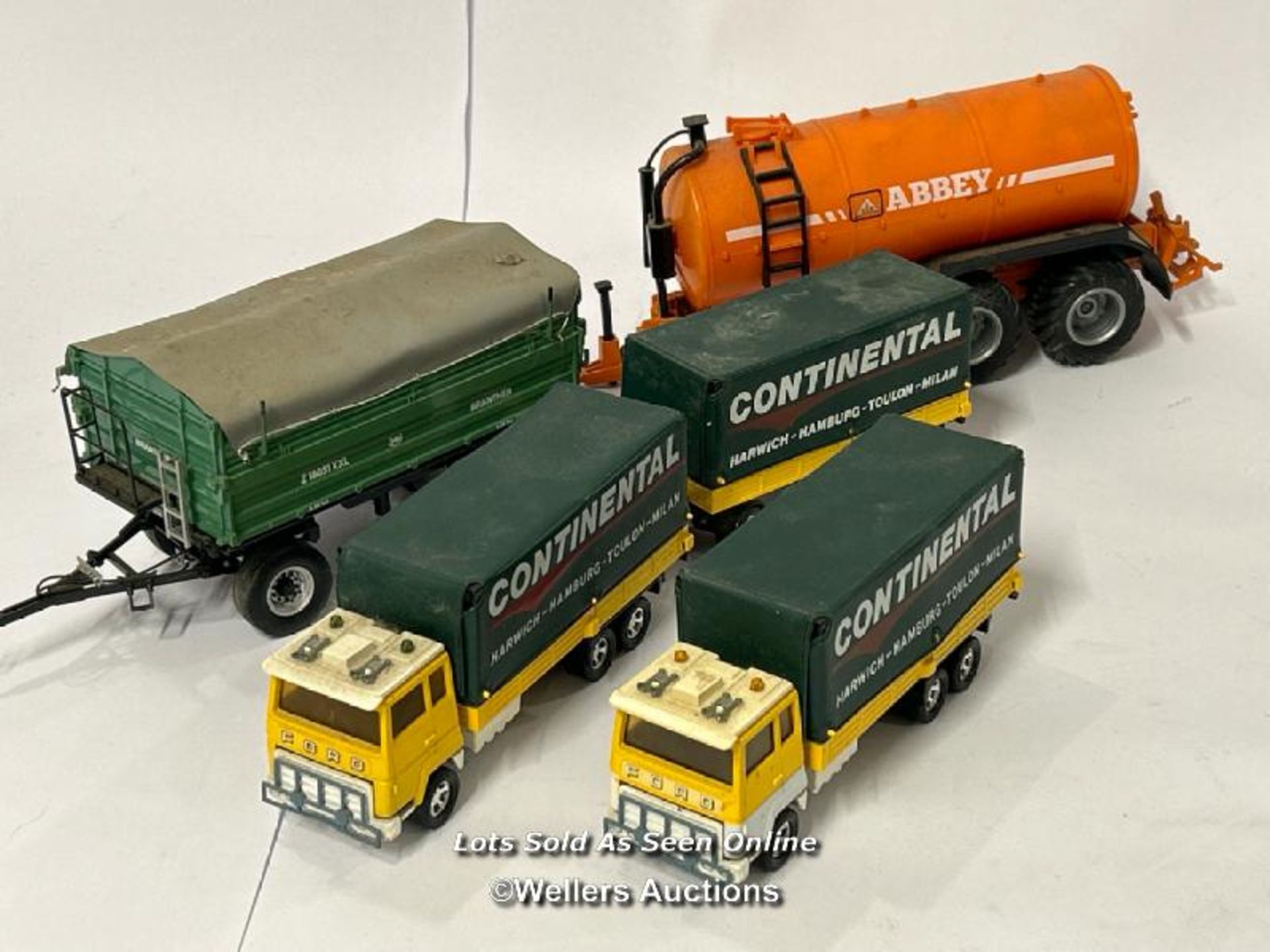 Two Matchbox Lesney Ford 'H' series trucks with one matching trailer, Branter 1:32 scale trailer and