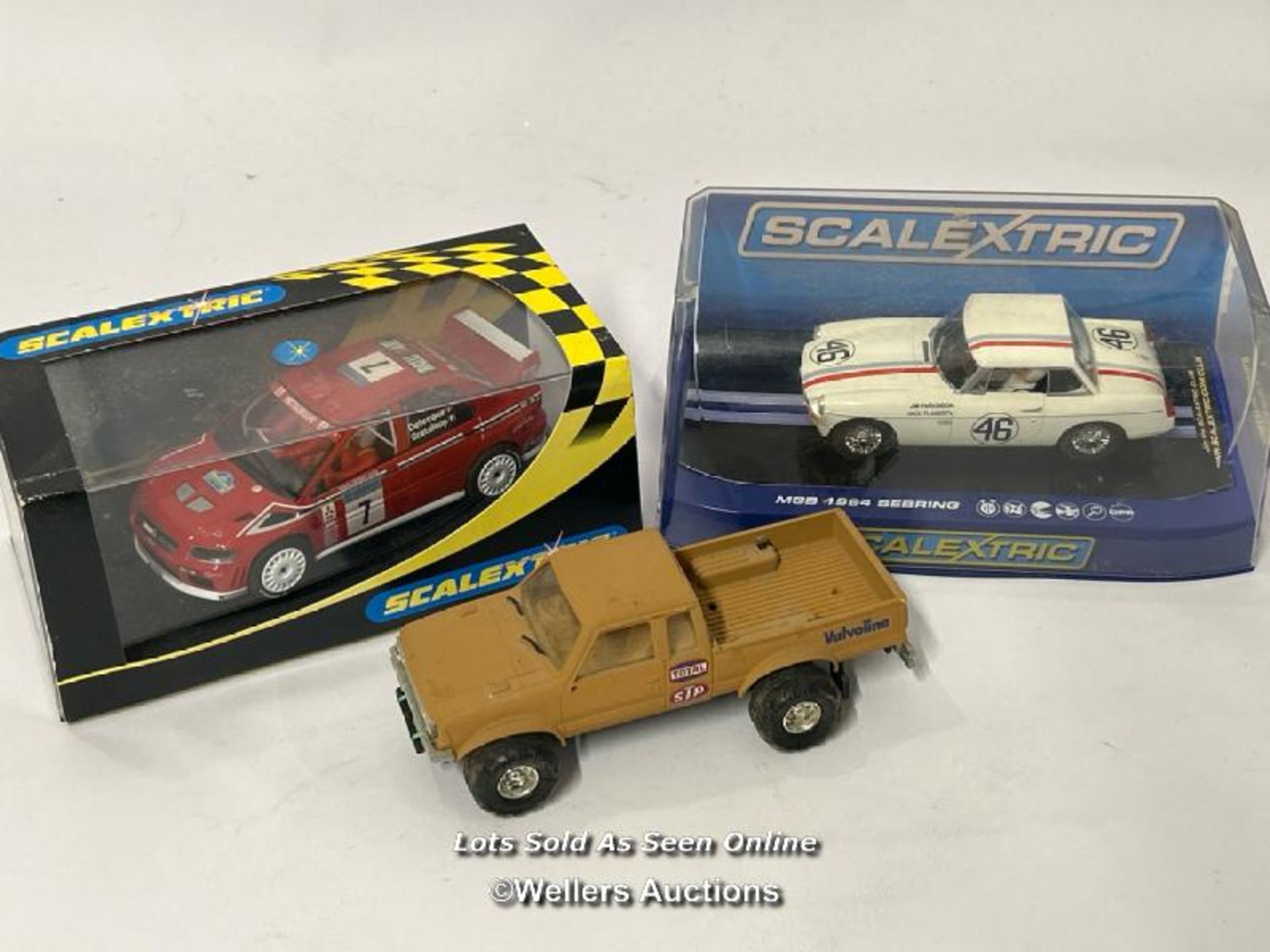 Three boxed & unboxed Scalextric cars including MGB 1964 Sebring and Mitsubishi Lancer / AN4