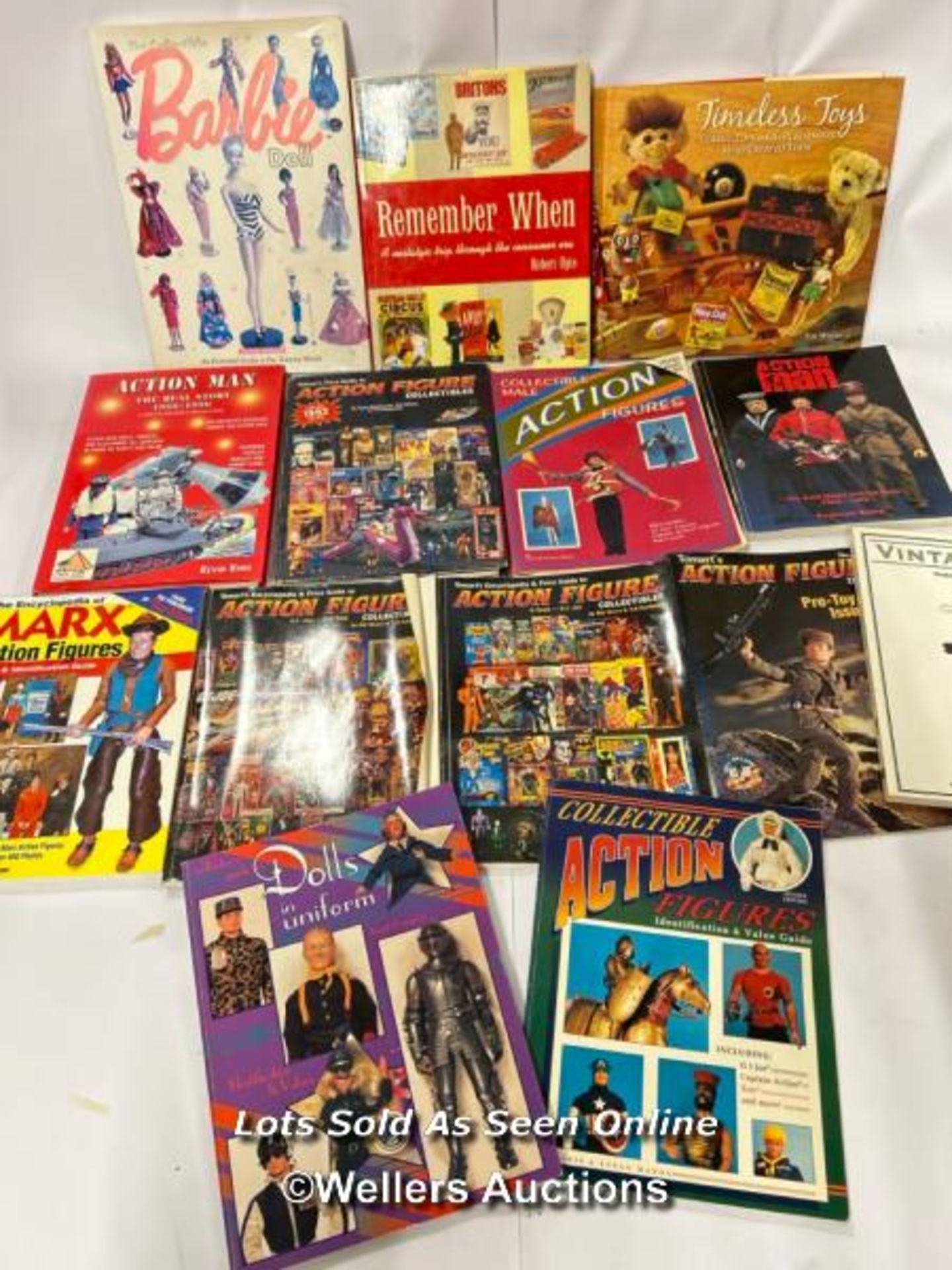 Fourteen assorted collecting books and magazines including Action Man, Barbie and Vintage Toys /