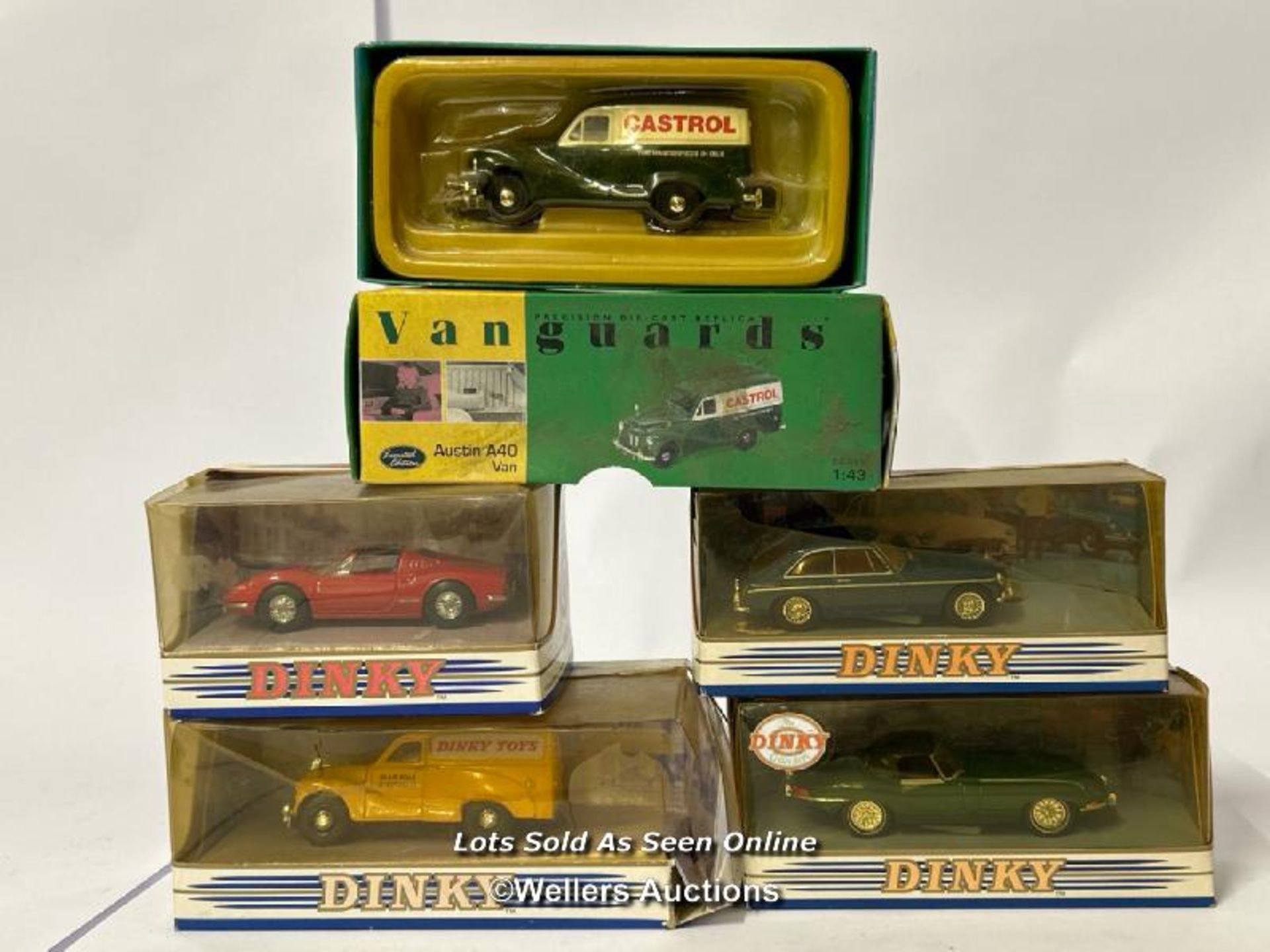 Four Dinky diecast cars and one Vanguards van including 1968 Jaguar E-type and 1973 Ferrari / AN3