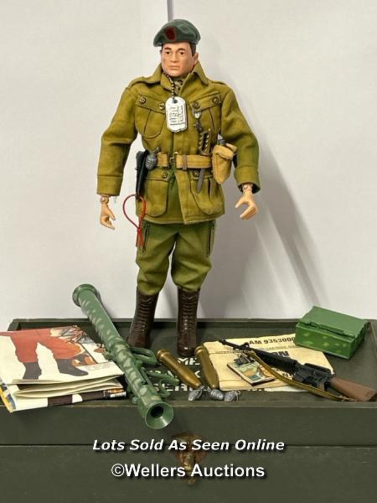 A 1964 Palitoy Action Man figure in American Green Beret fatigues and a wooden kit locker, Palitoy