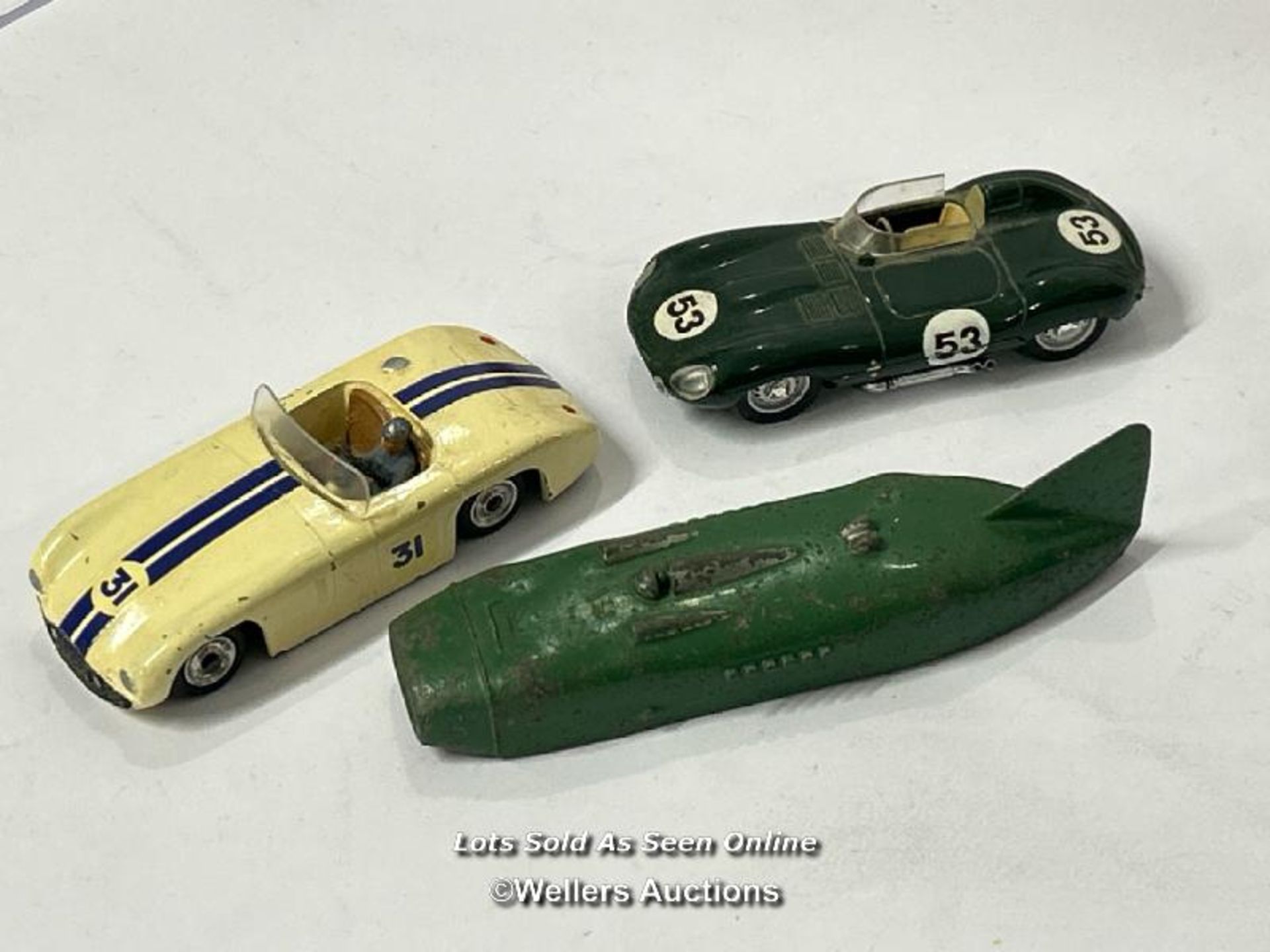 Three vintage diecast cars including Dinky no.133, Cunningham C-5R, off white body with brown