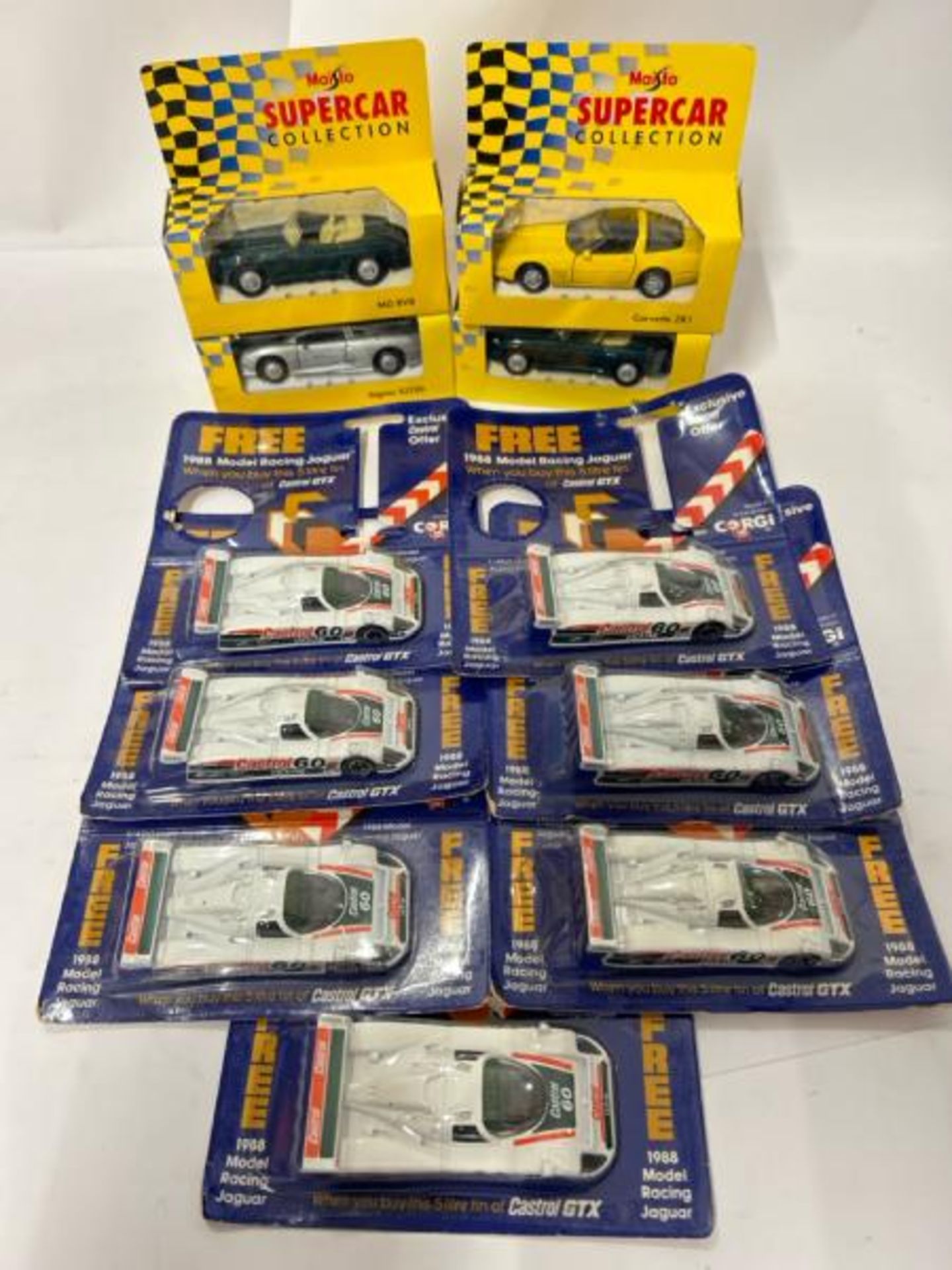 Four Maisto Super car collection models with seven Corgi 1988 promotional Jaguar racing cars, sealed