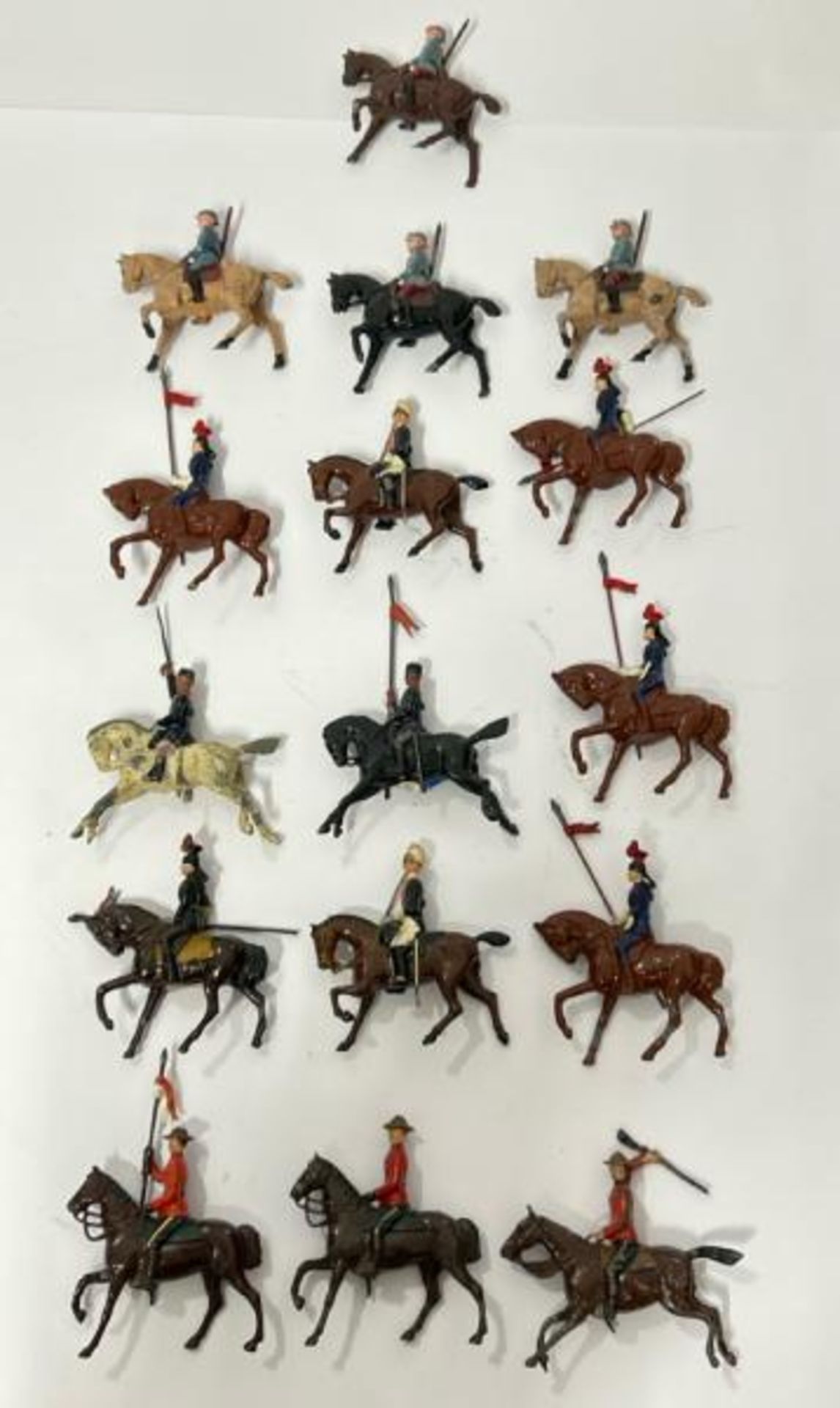 Britains lead horse mounted figures to include Canadian Mounted Police and assorted soldiers (