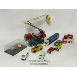 Assorted model vehicles including boxed Tomy Toyota Hilux Bigfoot, Corgi fire truck, Tesco truck and