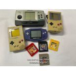 Three vintage hand held Game Boy consoles, all as found with three Pokémon games and Bad 'n' Rad