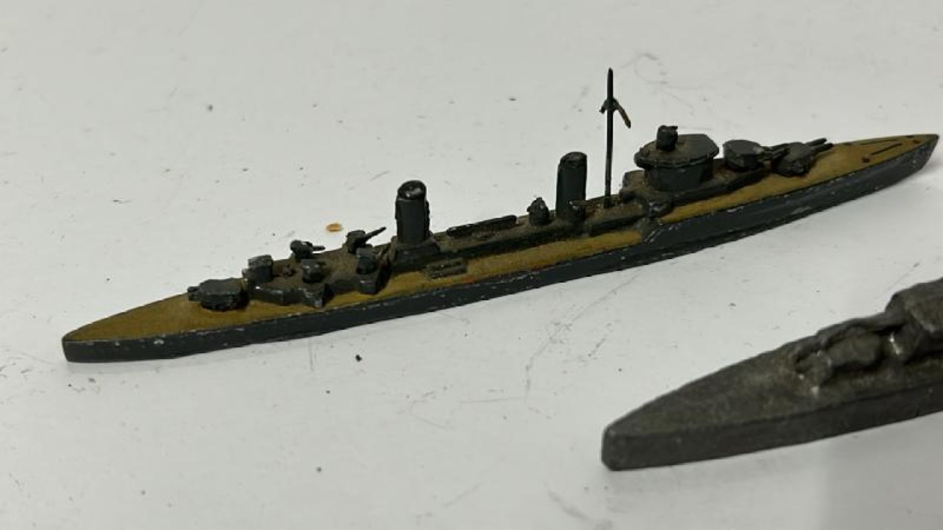Four small metal warship models and a small metal car / AN21 - Image 2 of 7
