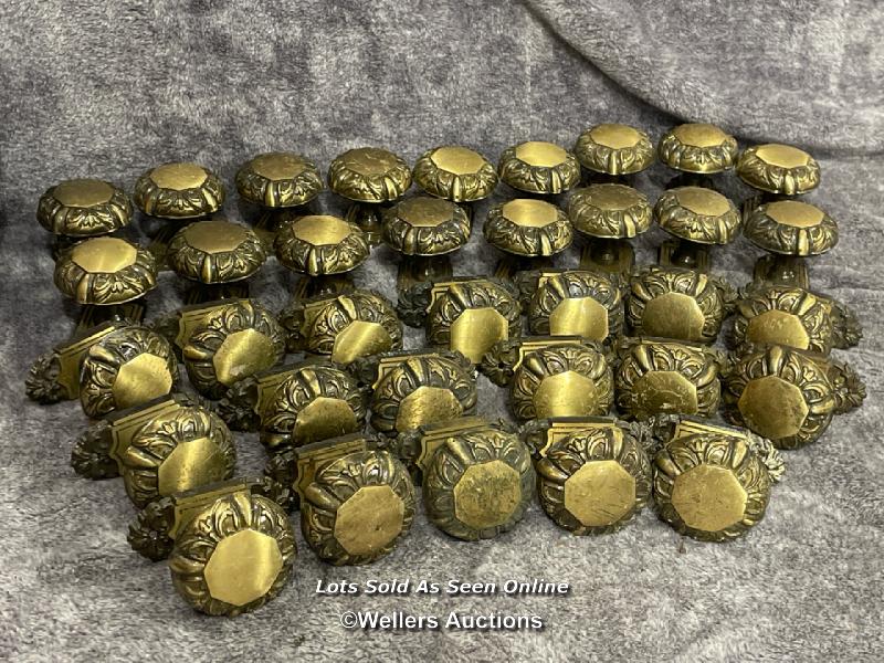 Thirty-five brass door handles with octagonal centrepiece surrounded by floral design edging, 5.