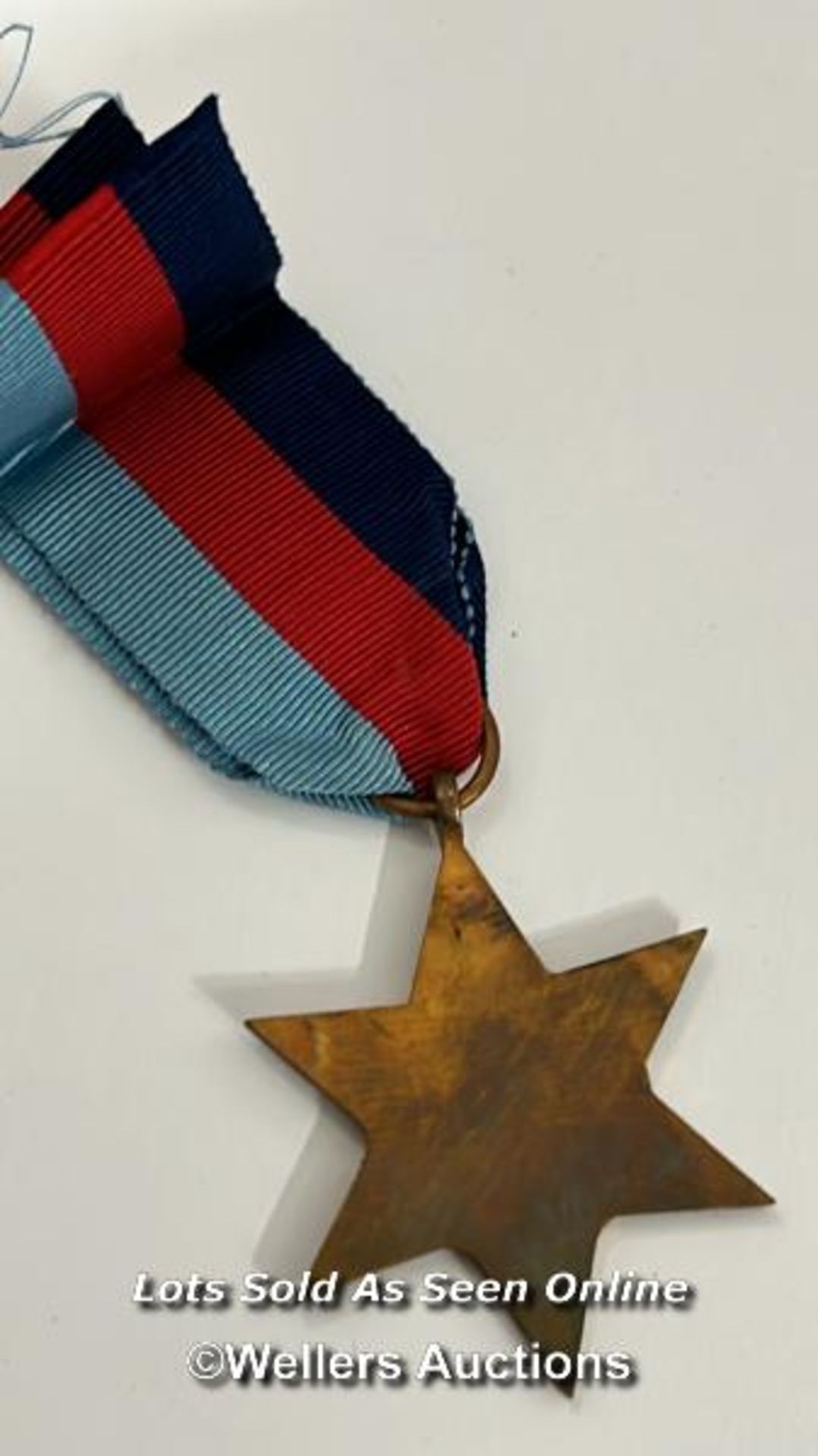 Four medals including the Italy star and the 1939-1945 star with a military cap badge stamped Silver - Image 5 of 13