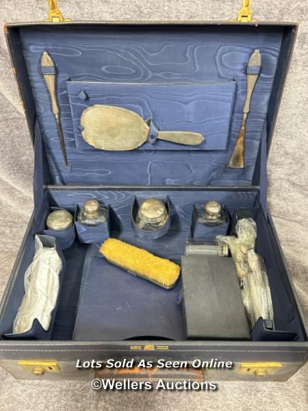 A travelling dressing table set (incomplete) comprising of hand mirror hallmarked 1928, silver