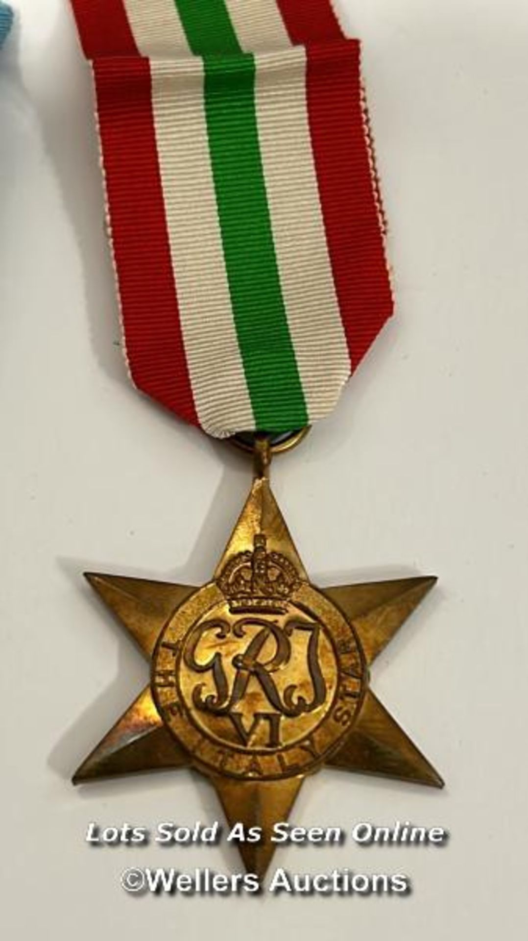 Four medals including the Italy star and the 1939-1945 star with a military cap badge stamped Silver - Image 2 of 13