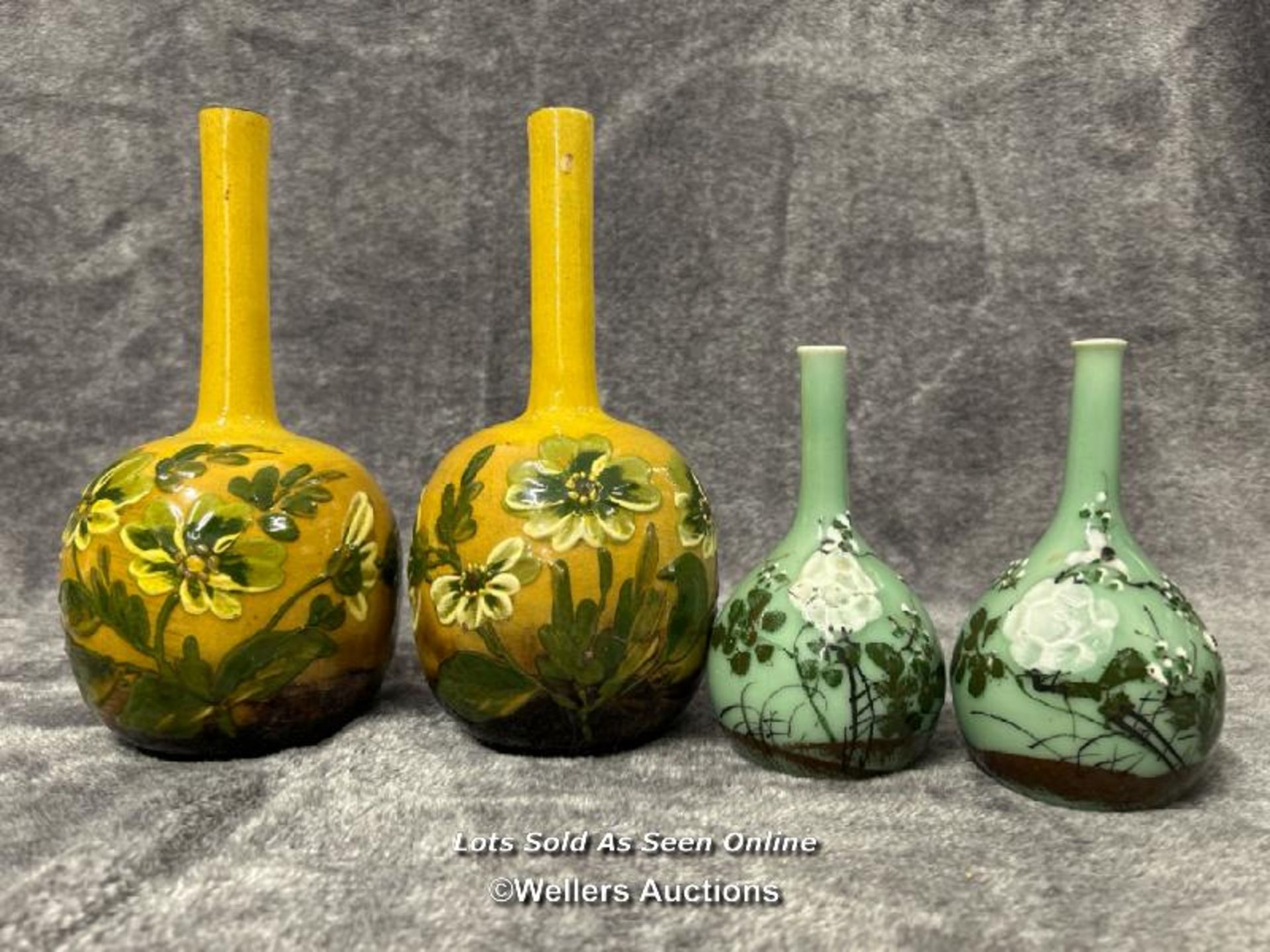 Two pairs of oriental style round based glazed pottery vases, the tallest 24cm high / AN6
