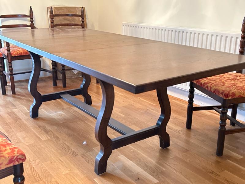 A solid mahogany fold over centre leaf table by Younger, 157 x 91 x 72cm (closed), 219 x 91 x