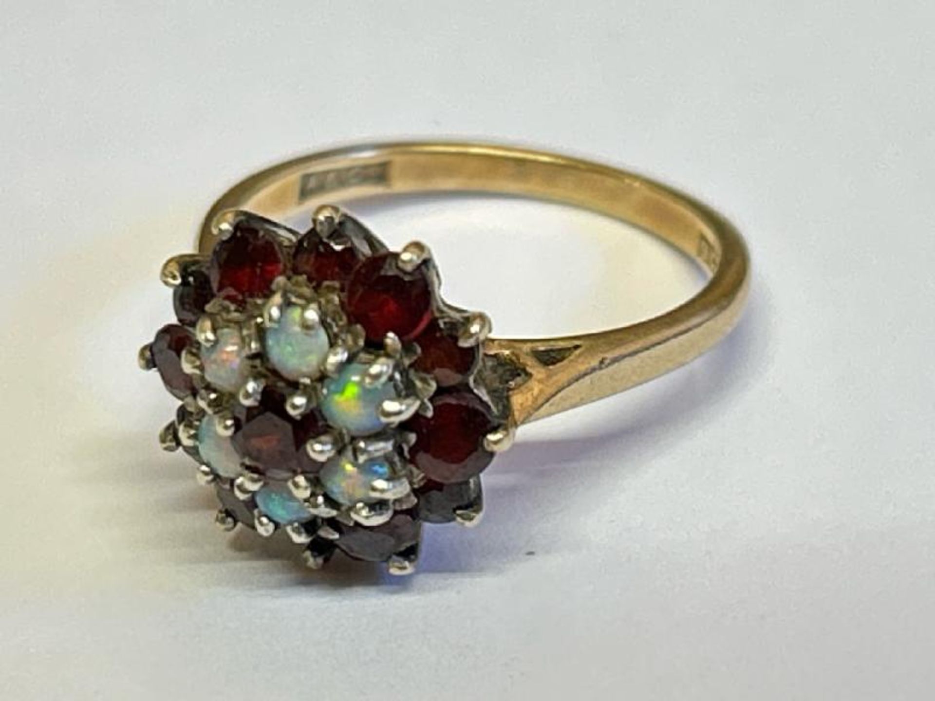 Opal and garnet cluster ring stamped 9ct gold. Ring size M, gross weight 3.89g / SF - Image 2 of 5