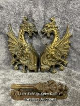 A pair of brass door fixtures in form of a dragon and one other iron door knocker, dragons 20cm high
