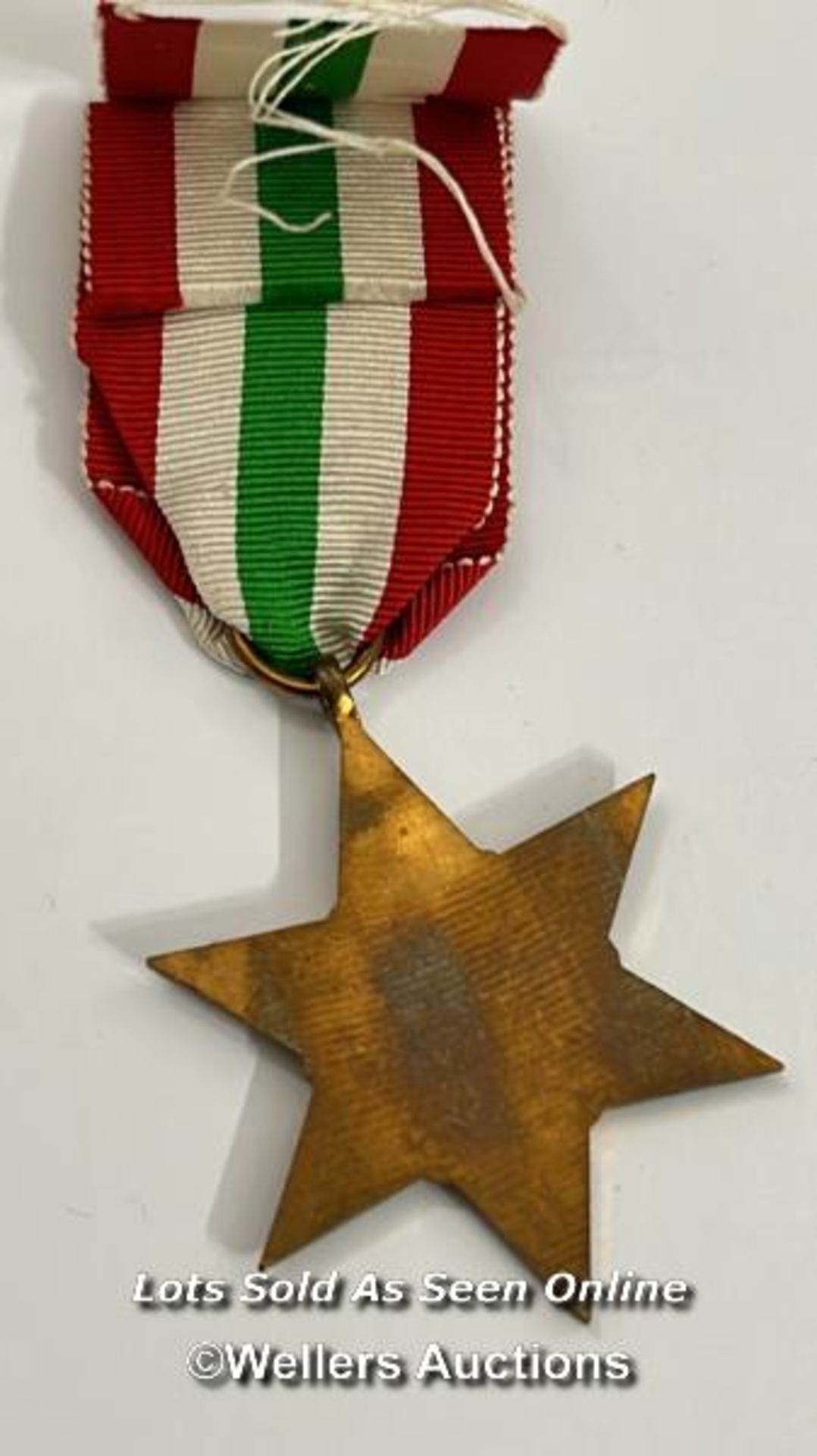 Four medals including the Italy star and the 1939-1945 star with a military cap badge stamped Silver - Image 3 of 13