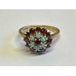 Opal and garnet cluster ring stamped 9ct gold. Ring size M, gross weight 3.89g / SF
