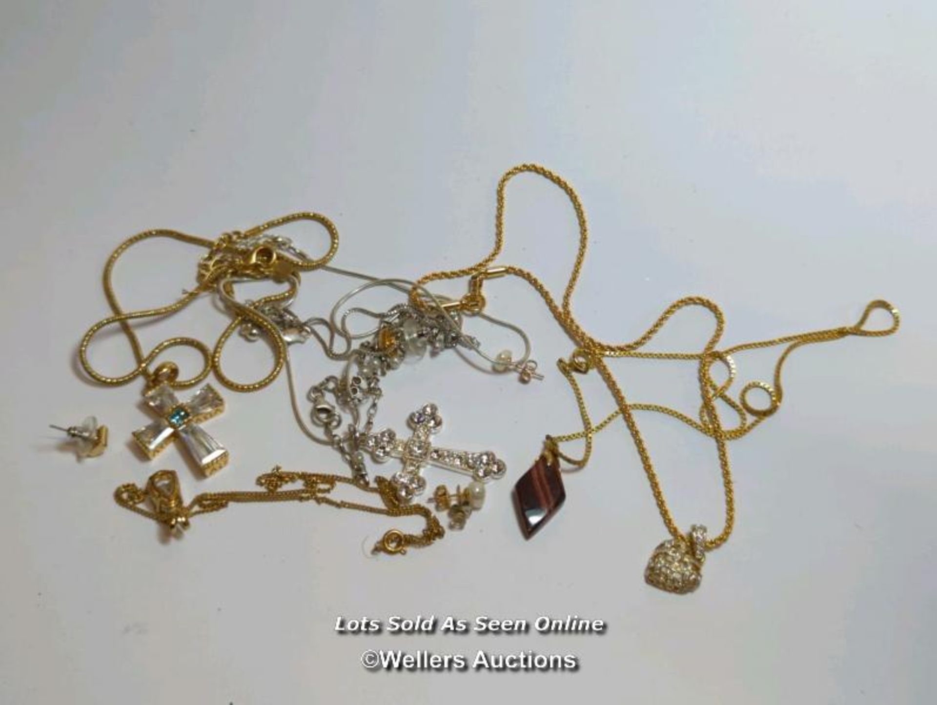 A lot of fashion jewellery, including a silver cross set with cubic zarconia, a silver bracelet with