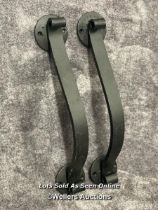 A pair of solid iron door pull handles in scroll form, 36.5cm long