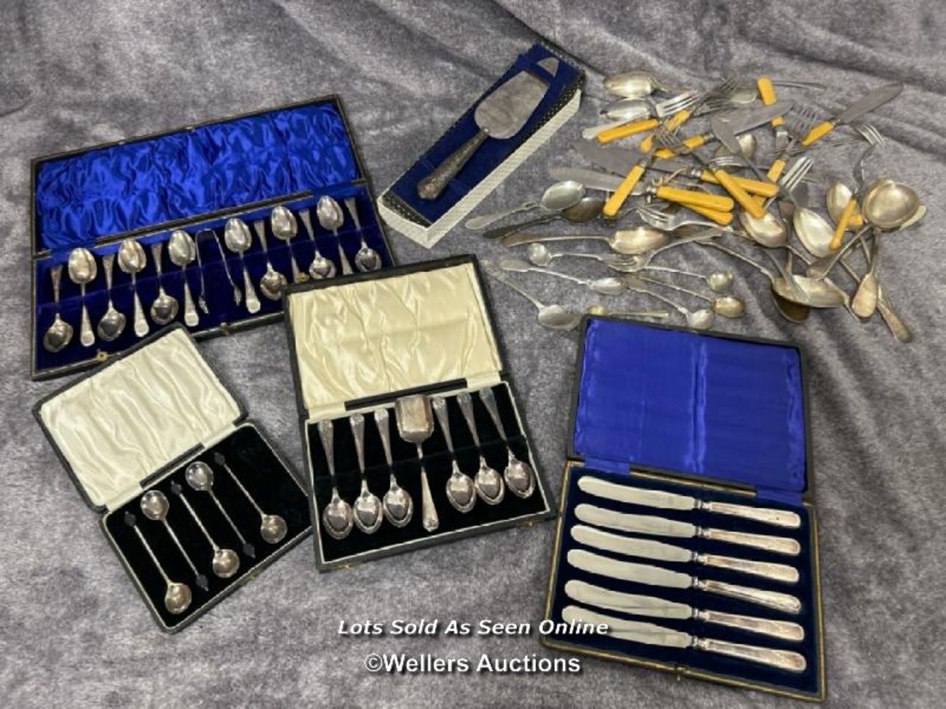 A quantity of boxed and unboxed cuttlery including a Webber and Hill hallmarked silver handled