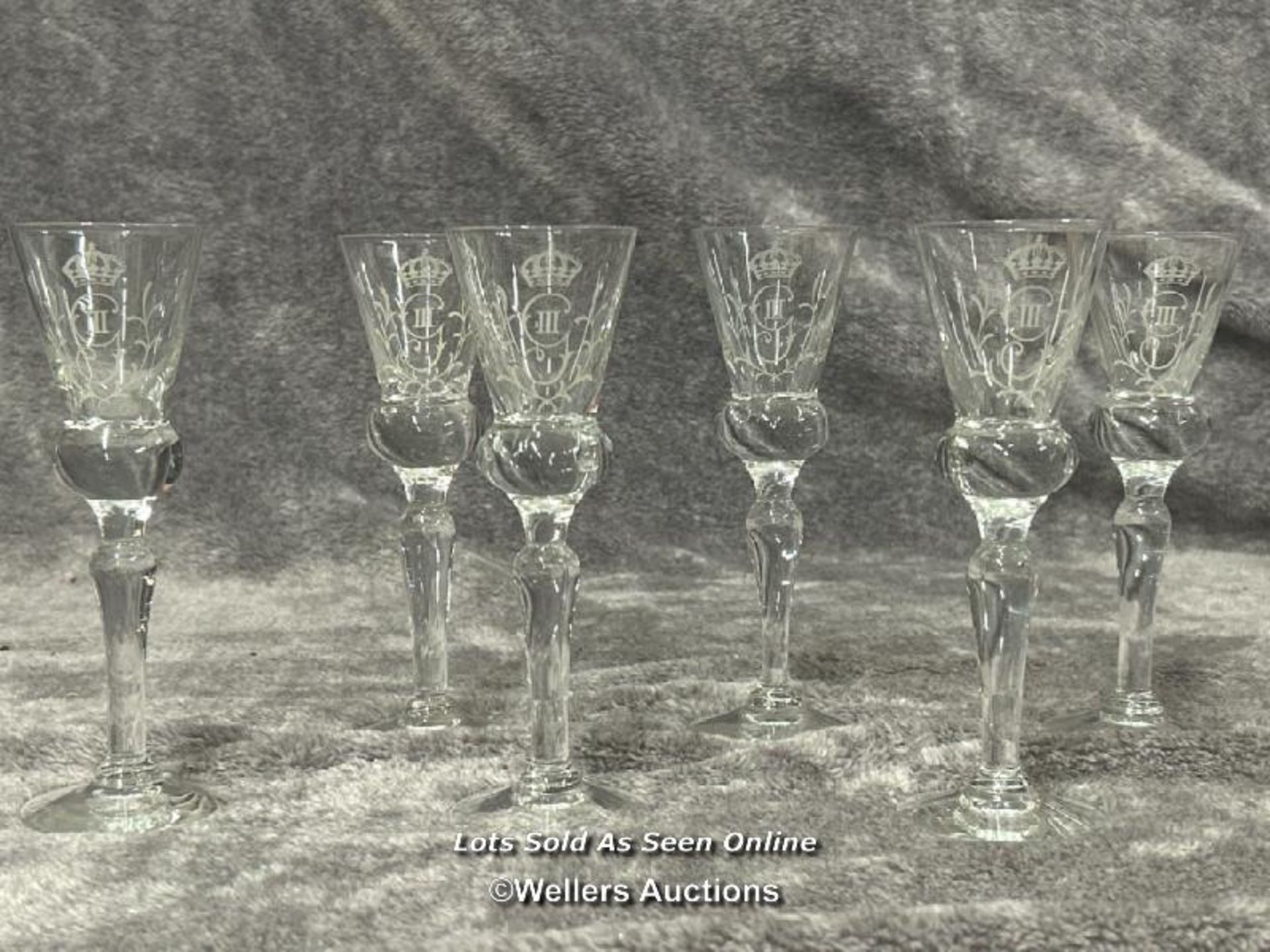 Six comemorative sherry glasses, 17cm high / AN34