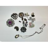 Quantity of costume jewellery including silver locket and chain, silver hallmarked brooches, paste