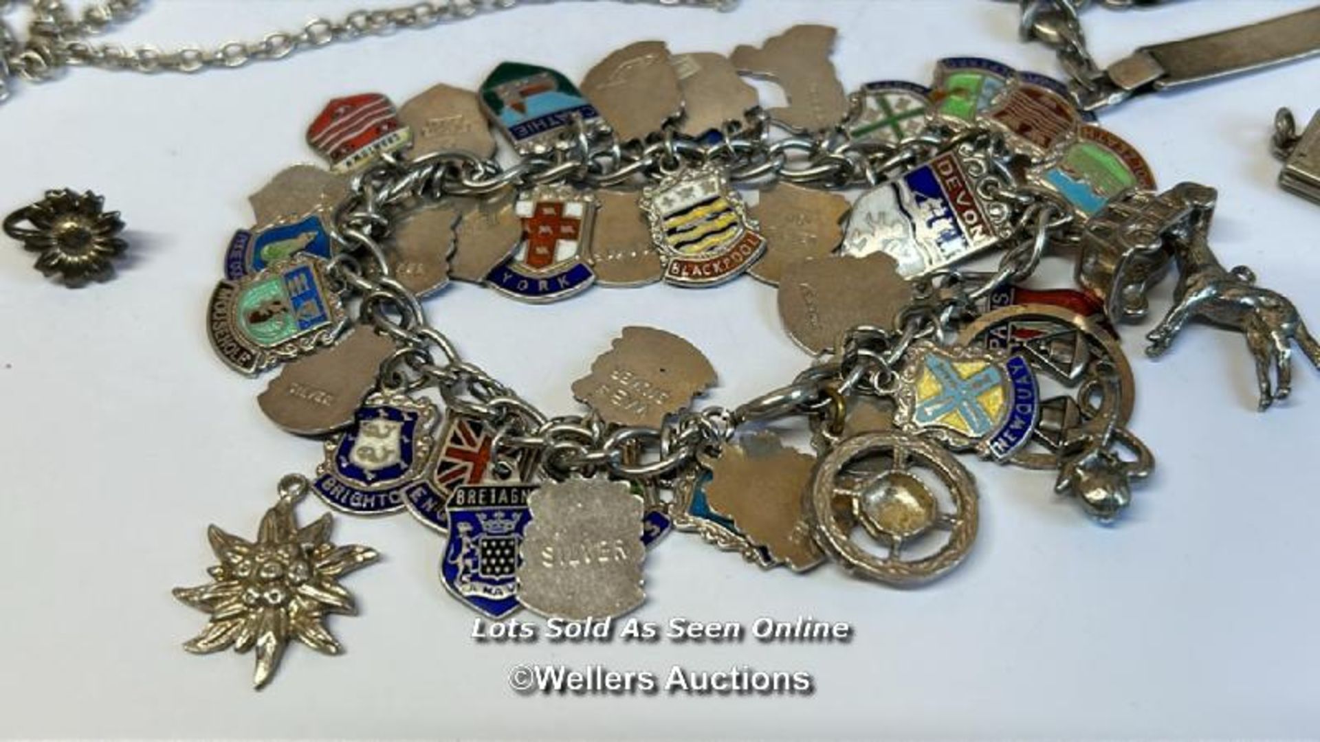Silver charm bracelet with thirty-eight mostly souvenir charms, along with a silver chain and - Image 2 of 6