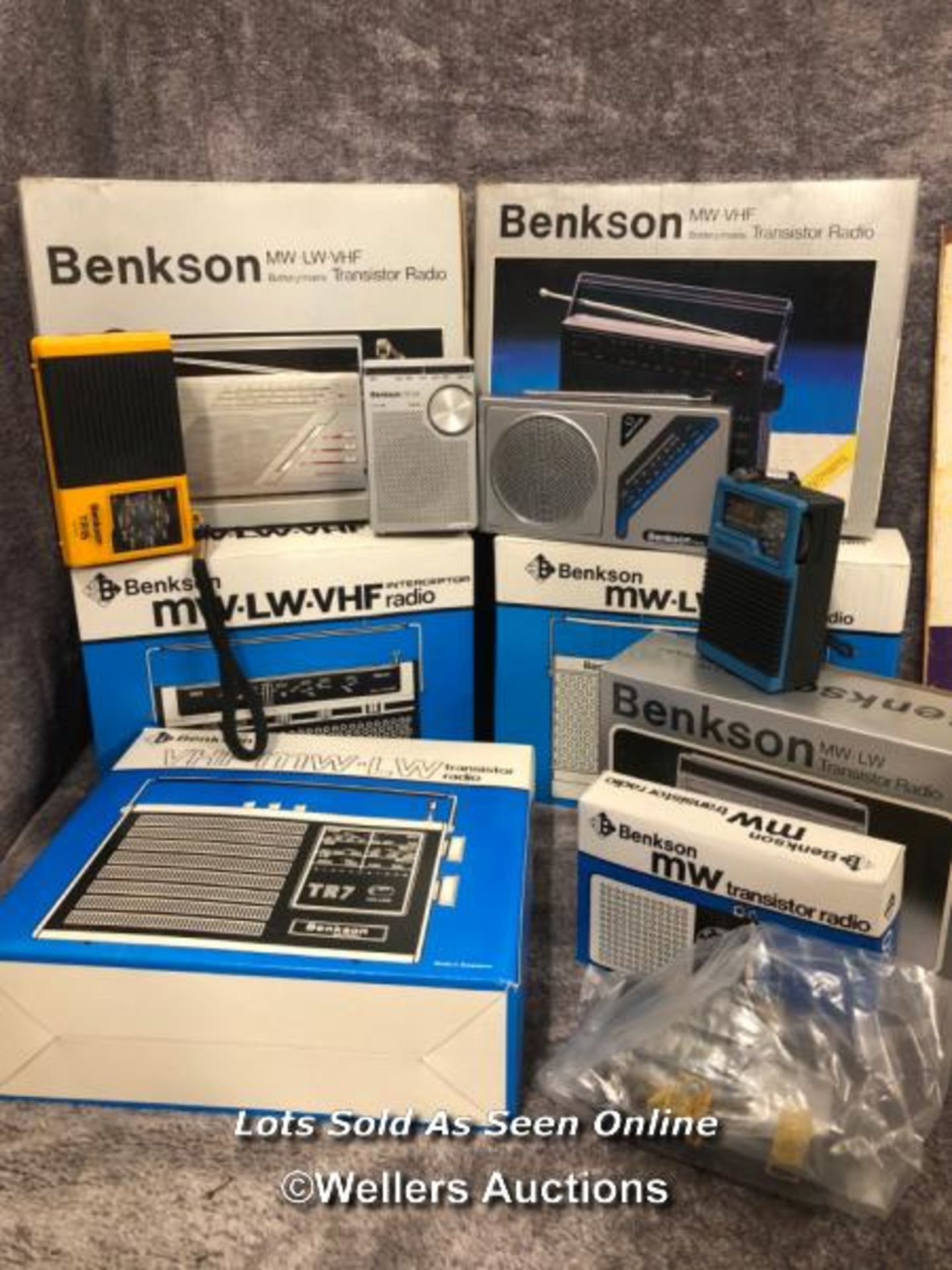 A collection of vintage Benkson transistor radios, models including TR58, TR59, TR34, TR15 and more,