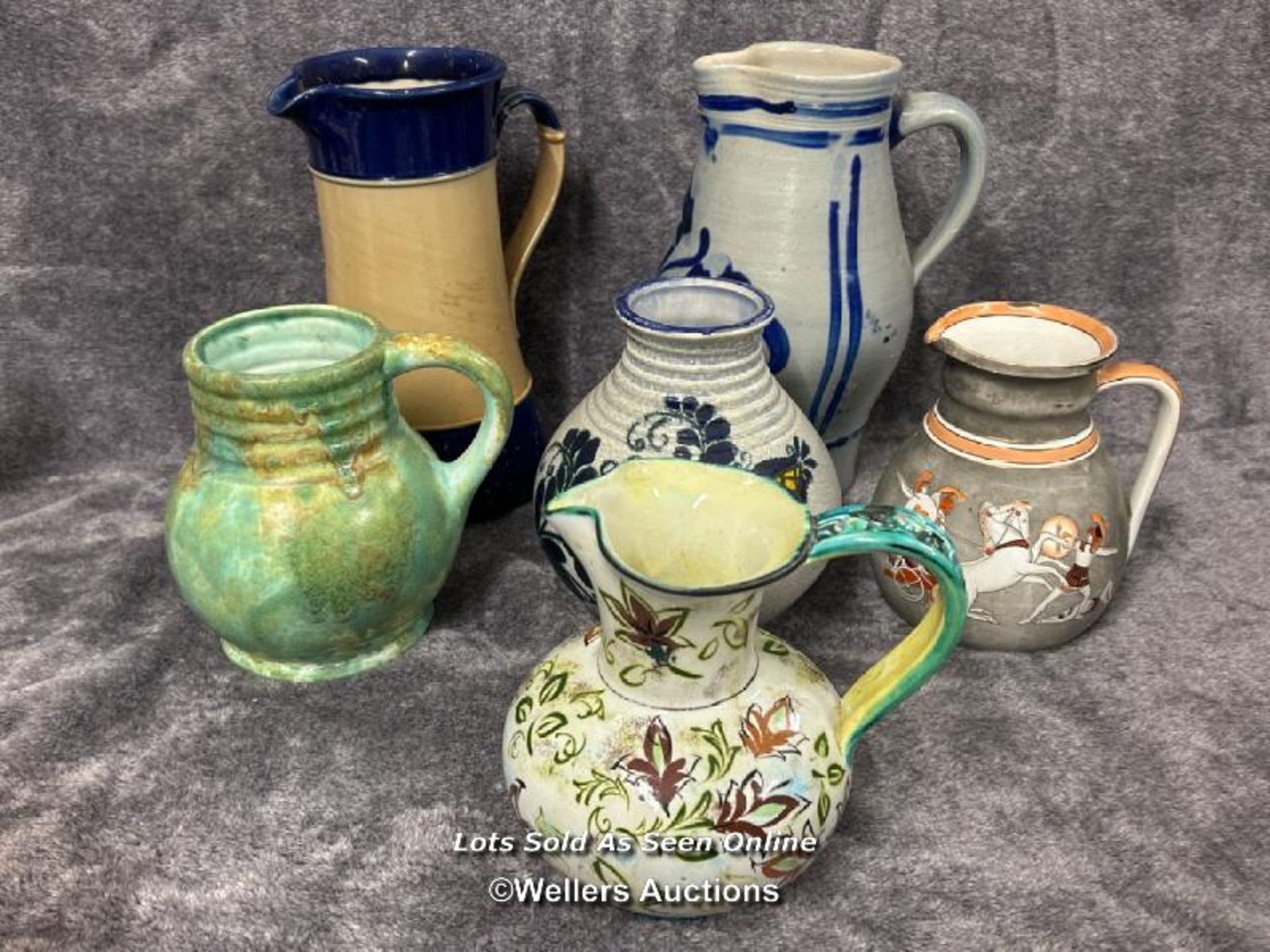 Six assorted pottery jugs including Royal Doulton / AN7