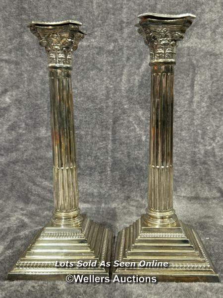 A pair of sterling silver candle holders in collumn form, hallmarks attributed to A Taite & Sons