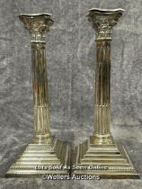 A pair of sterling silver candle holders in collumn form, hallmarks attributed to A Taite & Sons