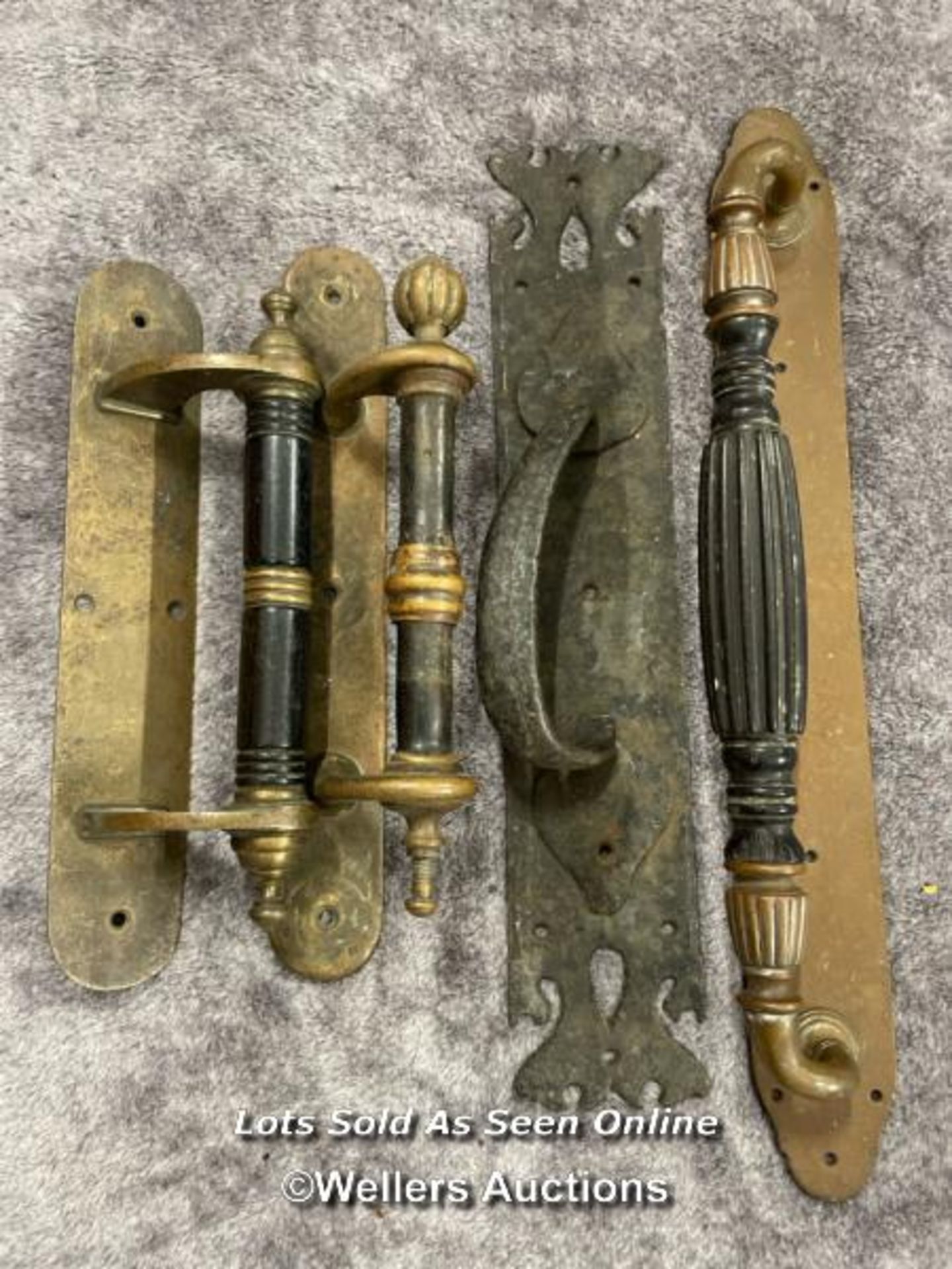 Four assorted door pull handles, longest 46cm