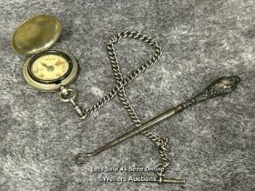 A floating compass with hallmarked silver chain and silver hallmarked button hook / T42