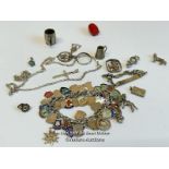 Silver charm bracelet with thirty-eight mostly souvenir charms, along with a silver chain and