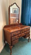 A five drawer walnut dressing table with bevelled mirror, 107 x 78.5 x 50cm, mirror 80cm (collection