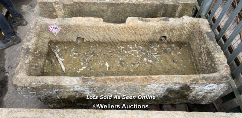 *A LARGE GRITSTONE QUARRY TROUGH, 45CM (H) X 170CM (L) X 76CM (W)