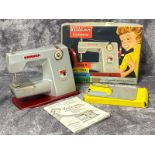 Boxed Vulcan child's electric sewing machine / AN32