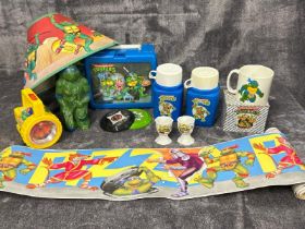 1980's - 1990's Teenage Mutant Hero Turtles items including lunchbox, Blockbuster Video mug, torch