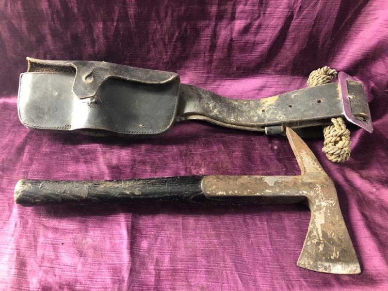 Early 20th century firemans axe with pouch, 38.5cm (l) x 20cm (w) / All lots are located at The