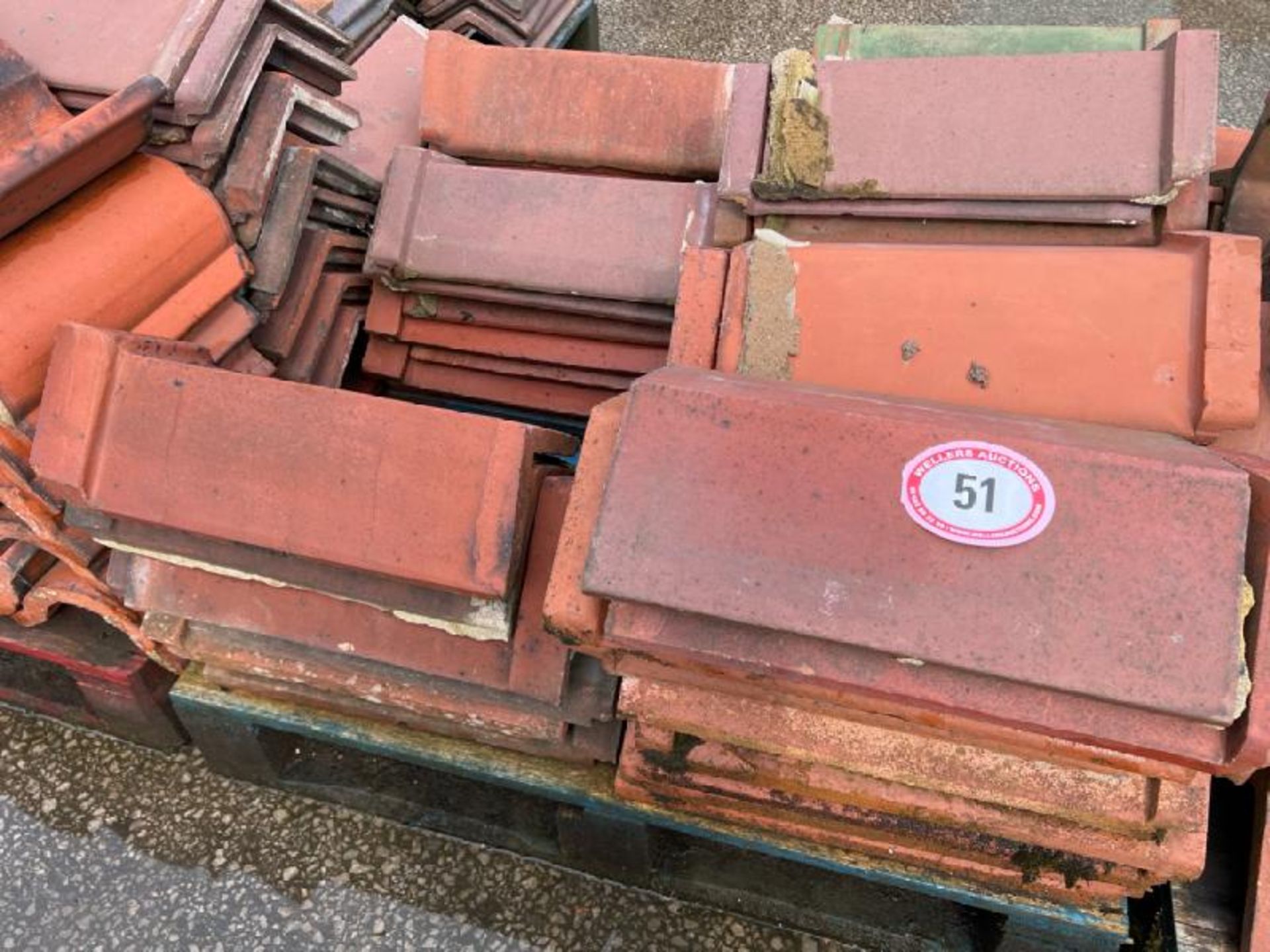 Pallet of approx. x50 terracotta ridge tiles, sizes and angles may vary