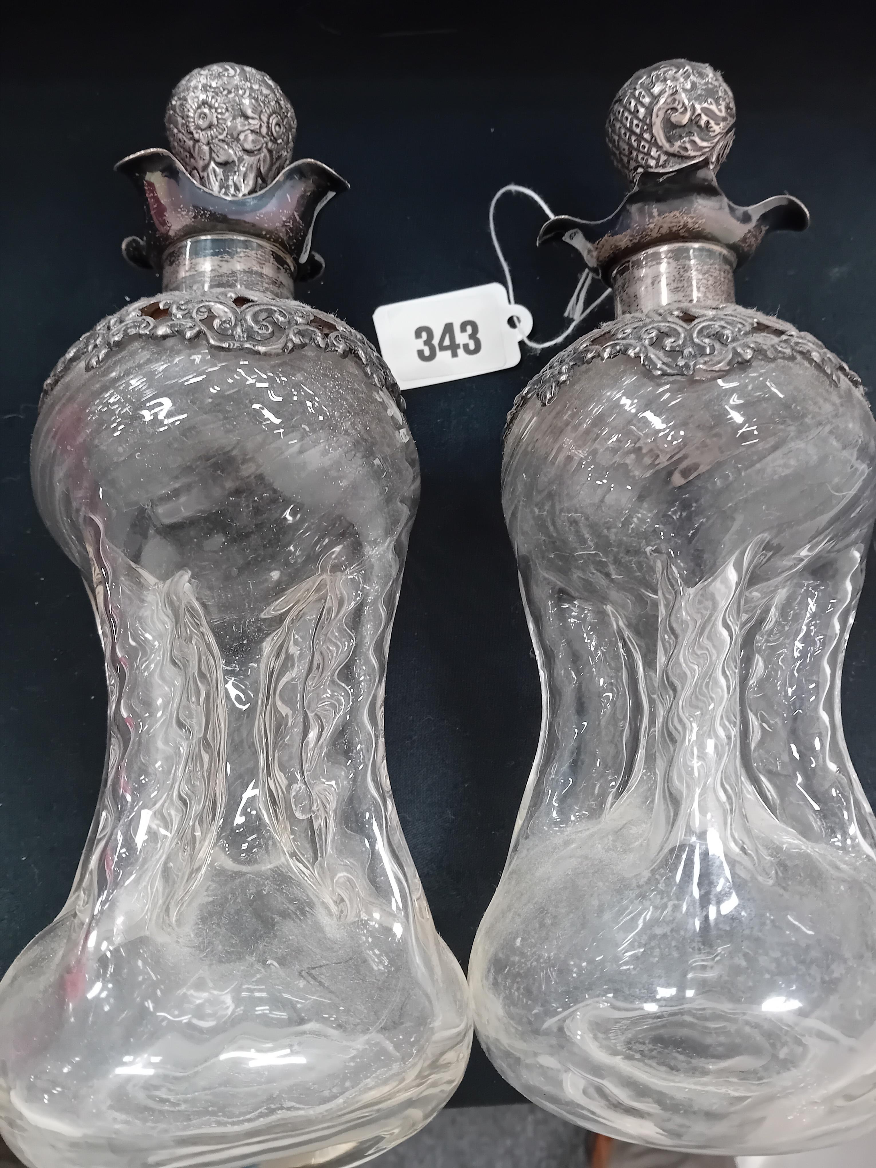 PAIR OF SHAPED GLASS DECANTORS