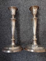 A PAIR OF LOADED HM SILVER CANDLESTICKS