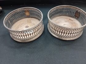 PAIR OF GEORGIAN HM SILVER WINE COASTERS