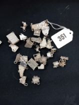 A COLLECTION OF SILVER PIANO CHARMS