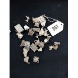 A COLLECTION OF SILVER PIANO CHARMS