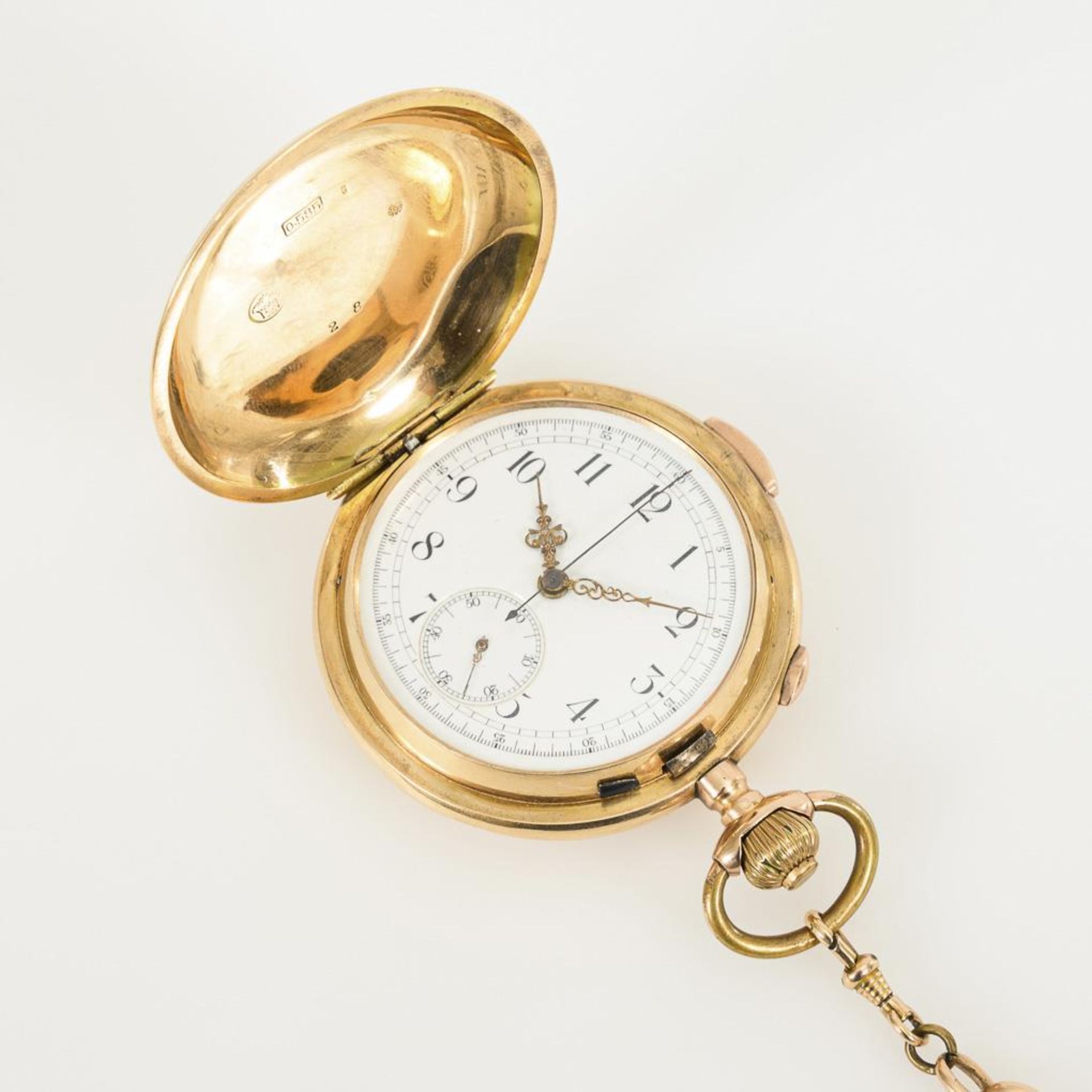 Goldene Savonnette mit Minutenrepetition und Chronograph an goldener Uhrenkette.