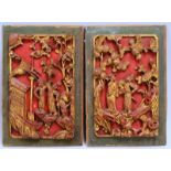 2 antike Holzschnitzereien - aus Kassetten von Schranktüren gefertig, mehrfarbig/goldgef.